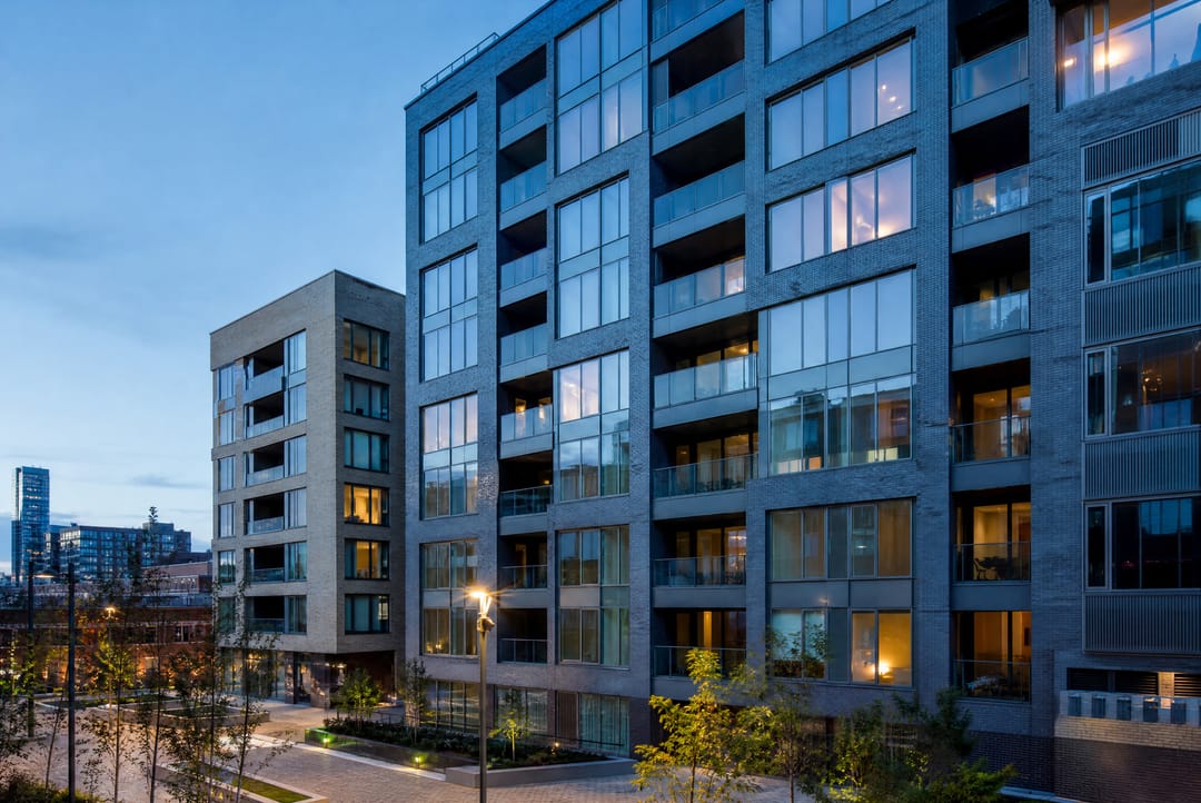Modern city-centre apartment building at blue hour