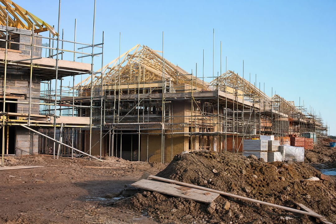 New-build houses with timber frames and scaffolding